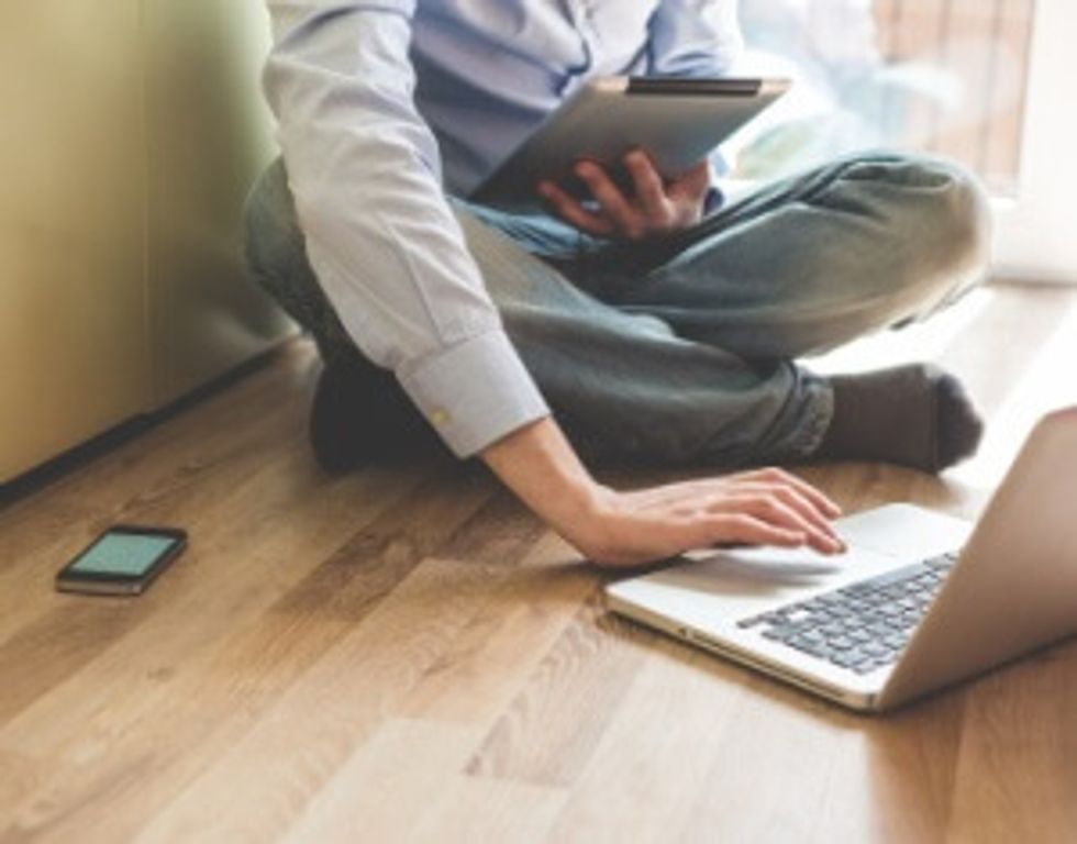 man using technology to multi-task