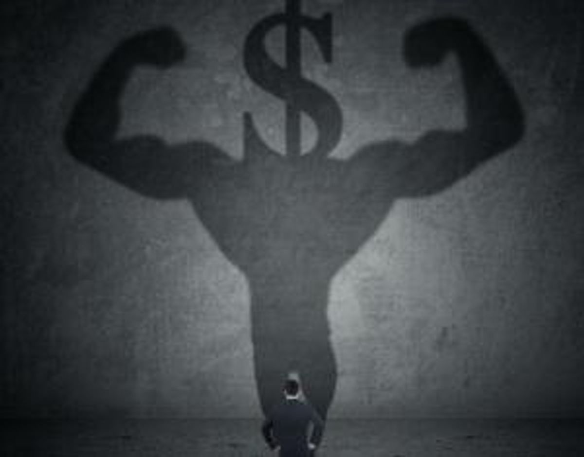 Man with a shadow of athlete and dollar sign