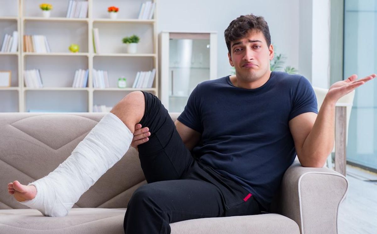 man with broken leg