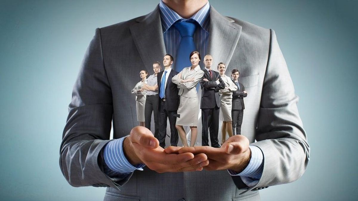 Manager holding employees for leadership development