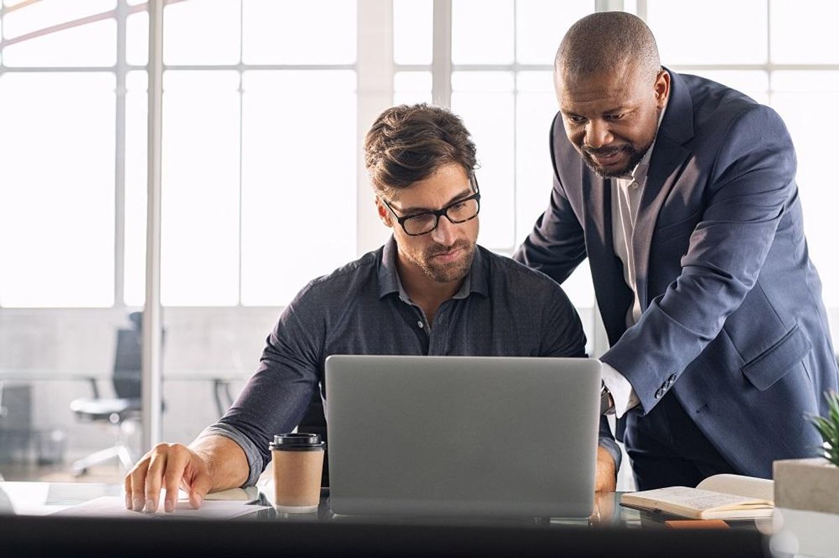 Manager working with his software engineer