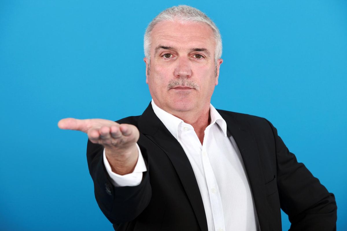 Mature business man asking for something