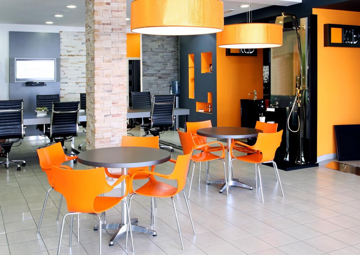 Modern office space with bright orange furniture