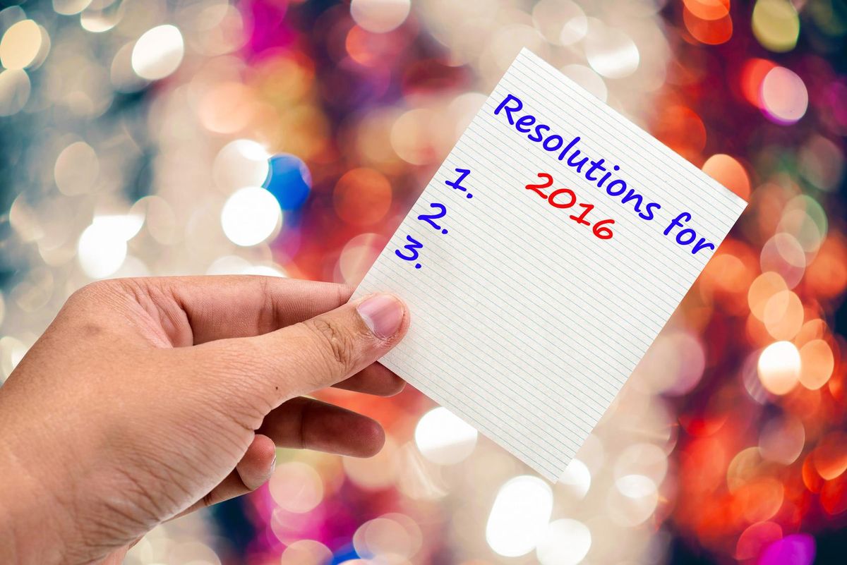 New Year's Resolution handwriting on a sticky note