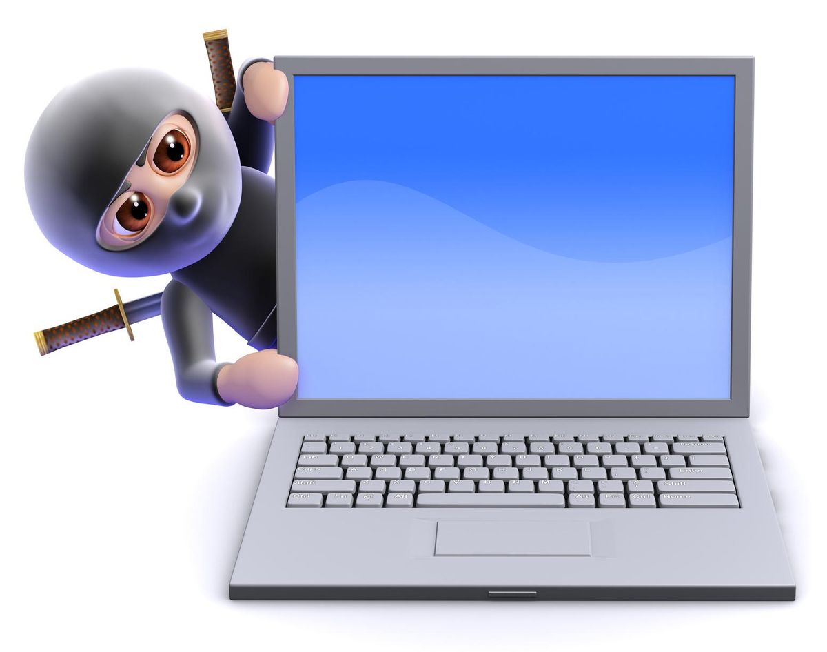 Ninja leans out from behind laptop
