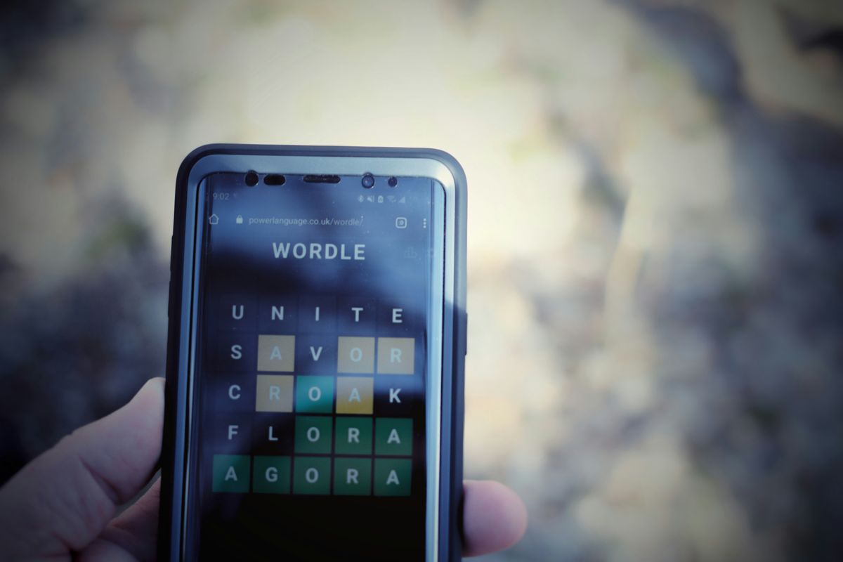 Person doing Wordle puzzle on their phone