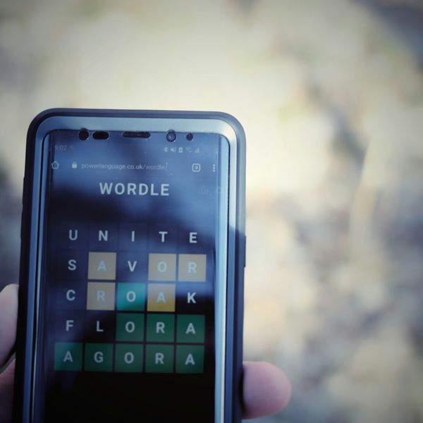 Person doing Wordle puzzle on their phone