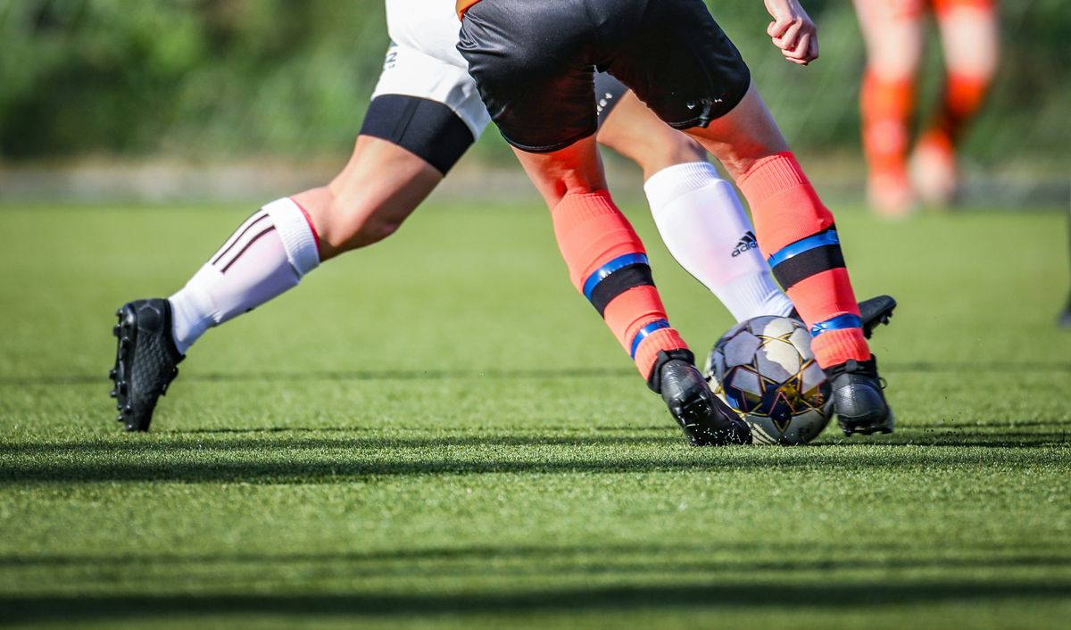 Playing soccer on a field