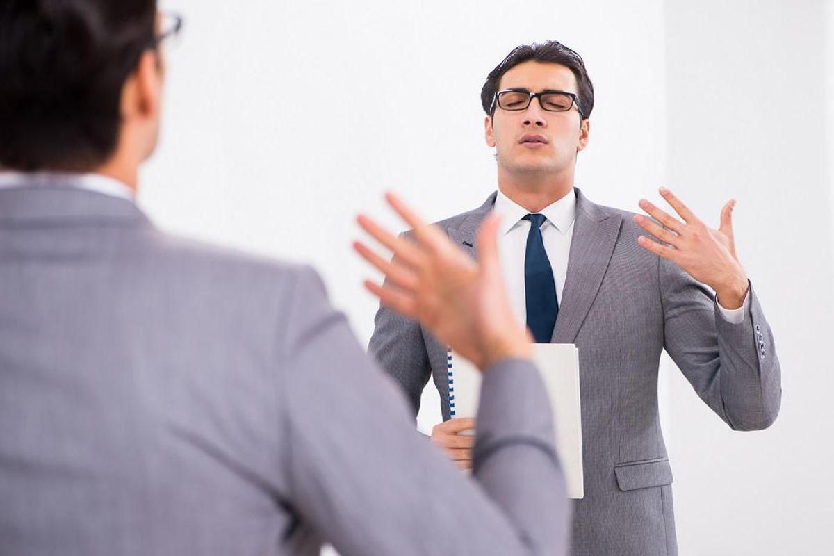 practicing speech in front of mirror