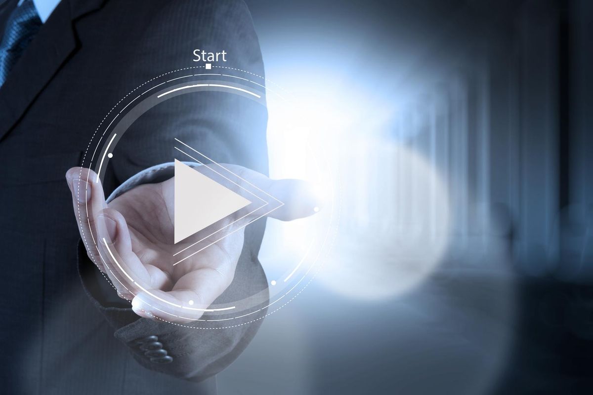 Pressing play button on corporate video