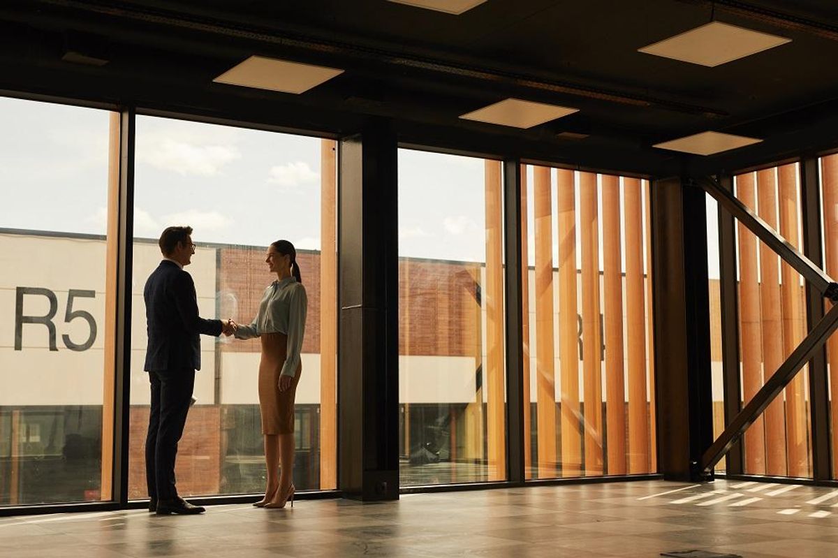 real estate agent shaking hands on office space lease
