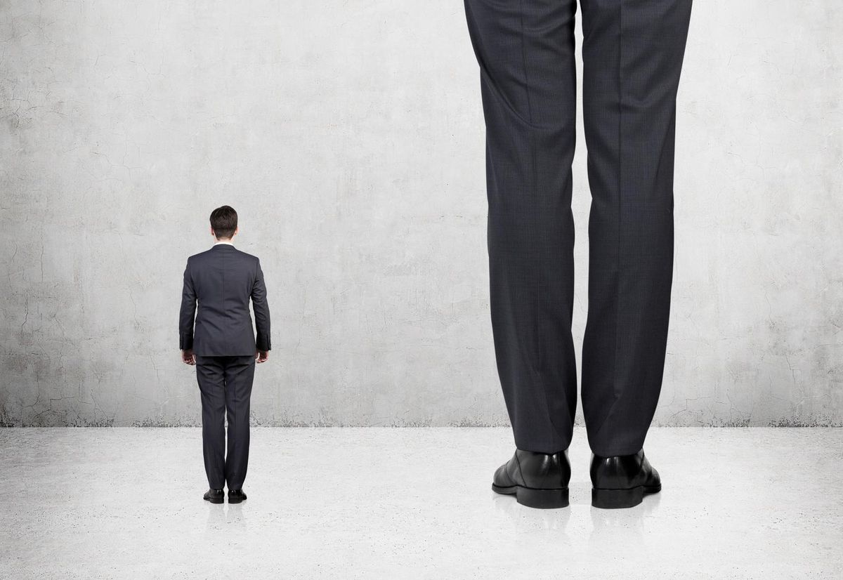 Rear view of a tall and short businessmen