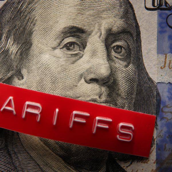 Red Tariffs label on a hundred dollar bill