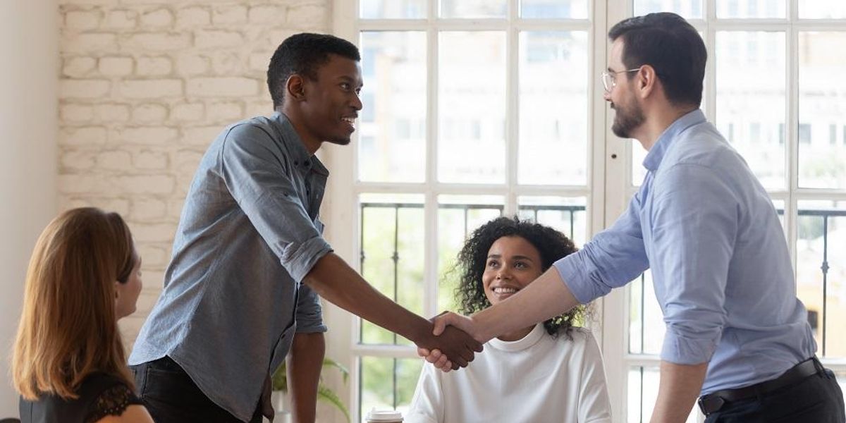 Shaking hands after pitching startup idea to investor