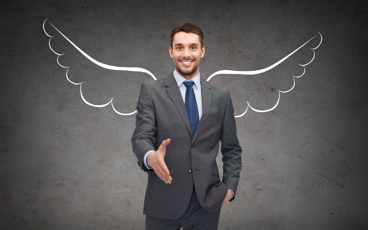 Shaking hands with angel investor after negotiations
