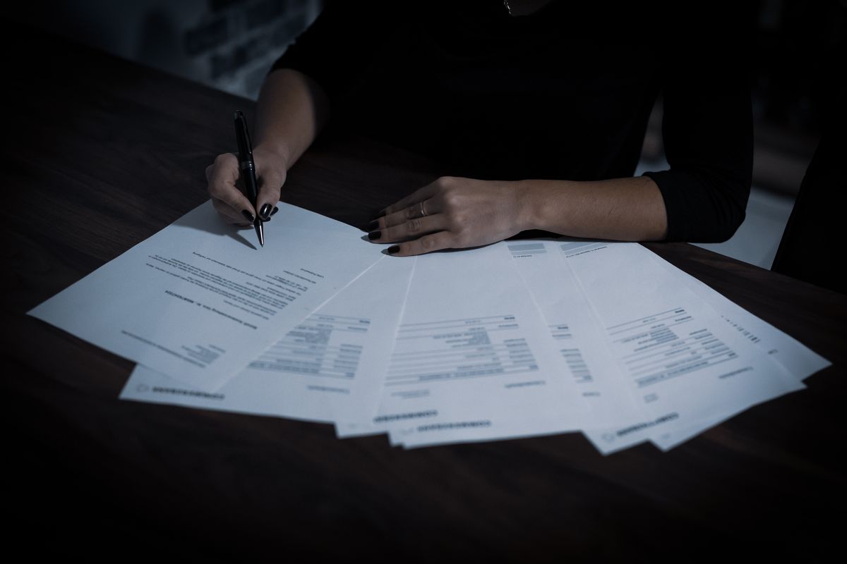 Signing documents to buy a distressed company