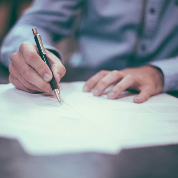 Signing papers to incorporate a business
