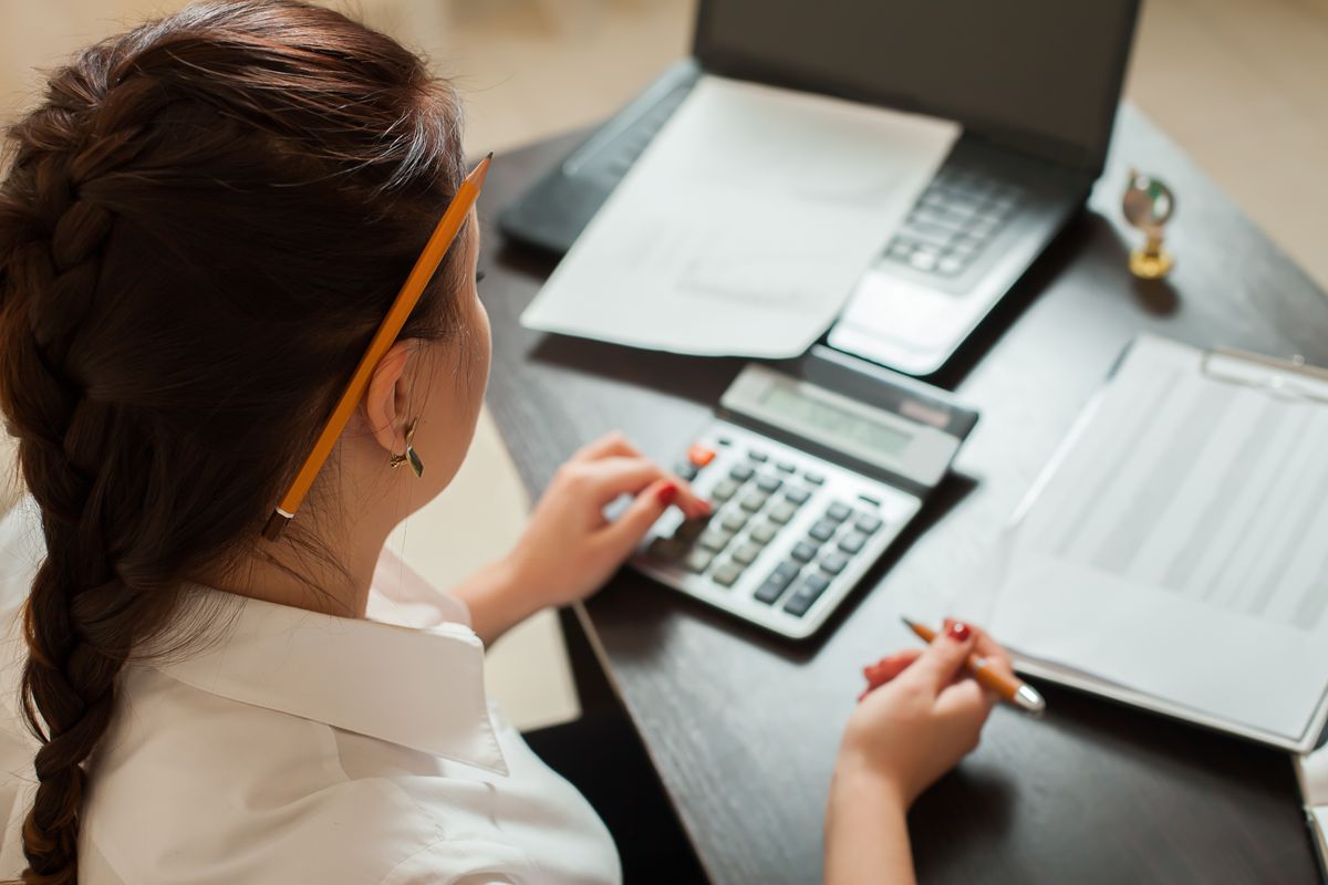 Small business owner doing budgeting for marketing
