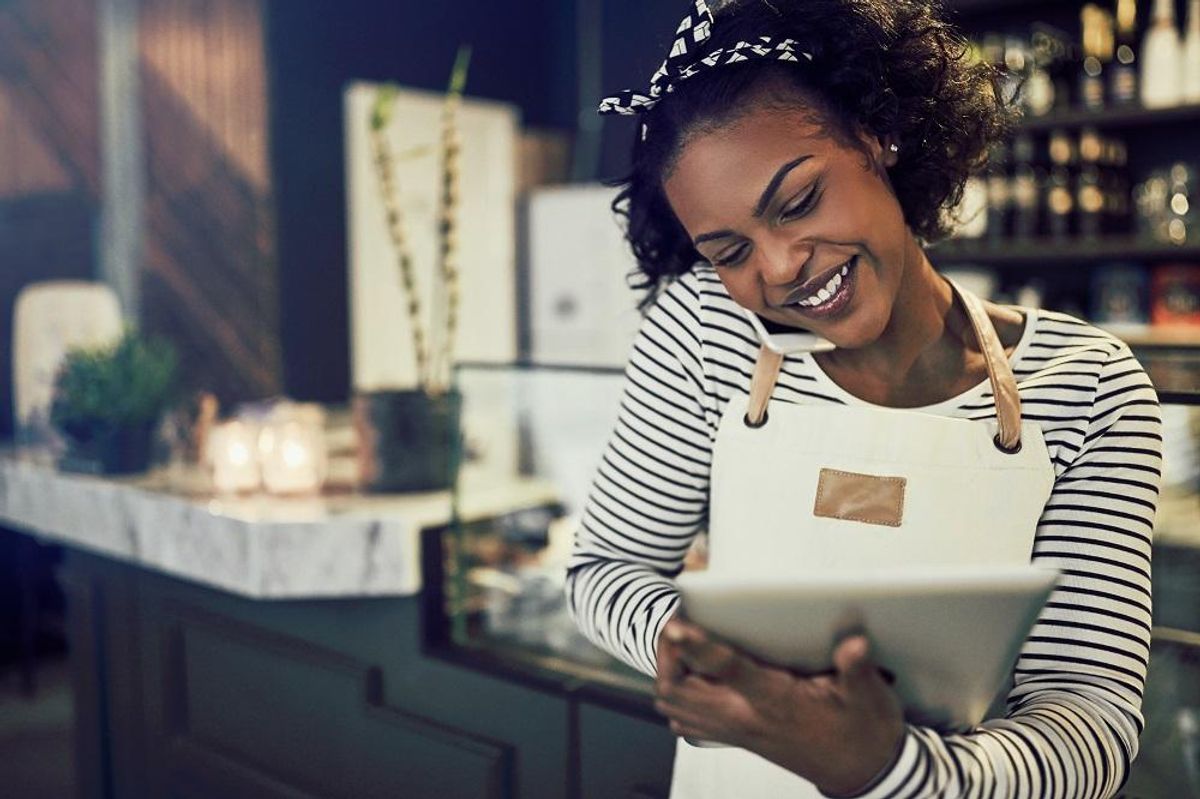 Small business owner doing marketing tasks
