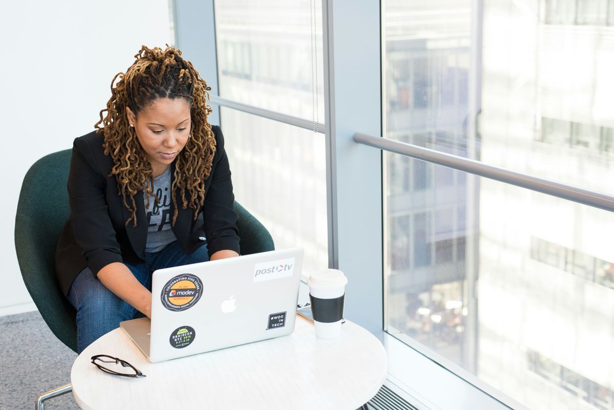 Small business owner looking at end-of-year checklist