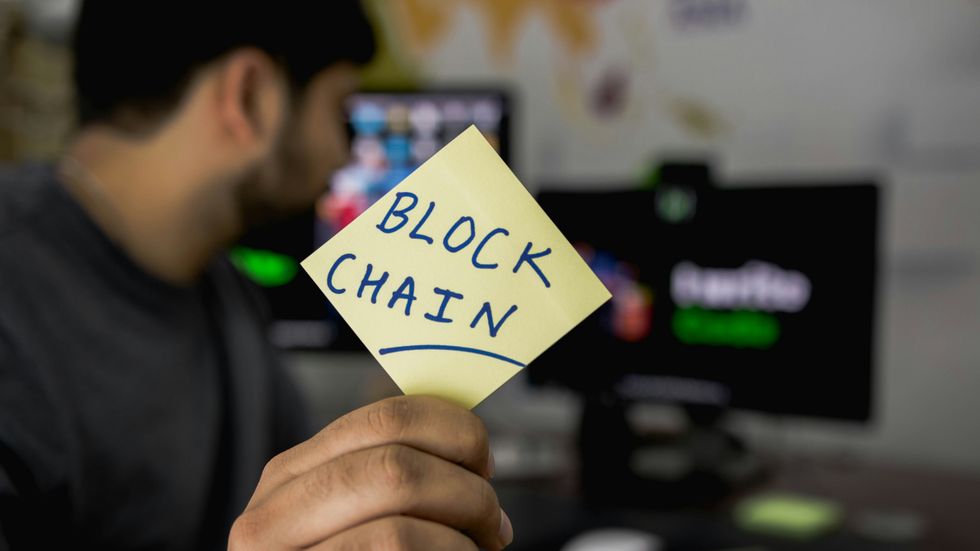 Small business owner using blockchain in his business