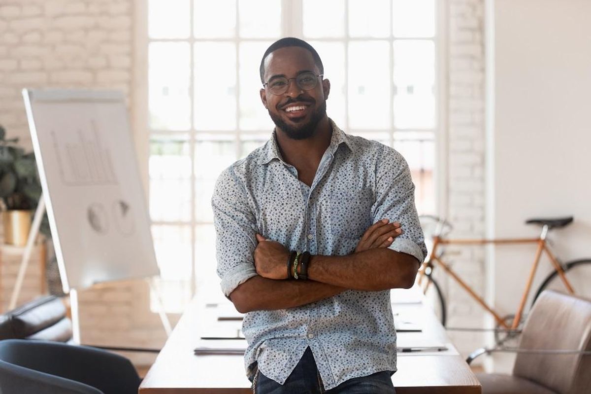 Smiling confident young businessman