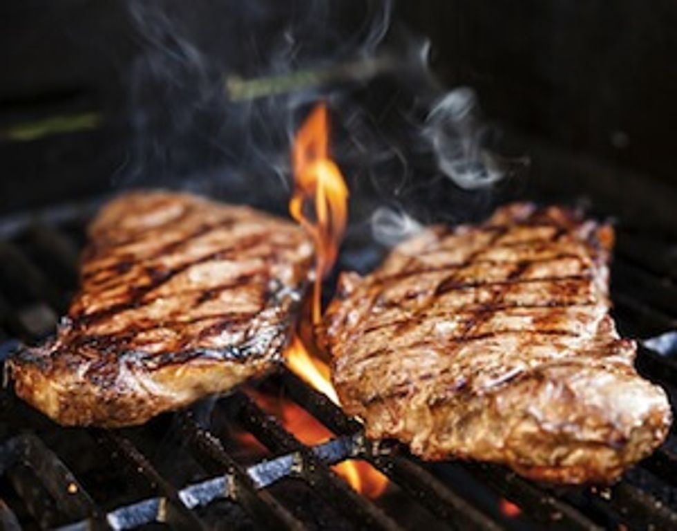steaks on BBQ grill