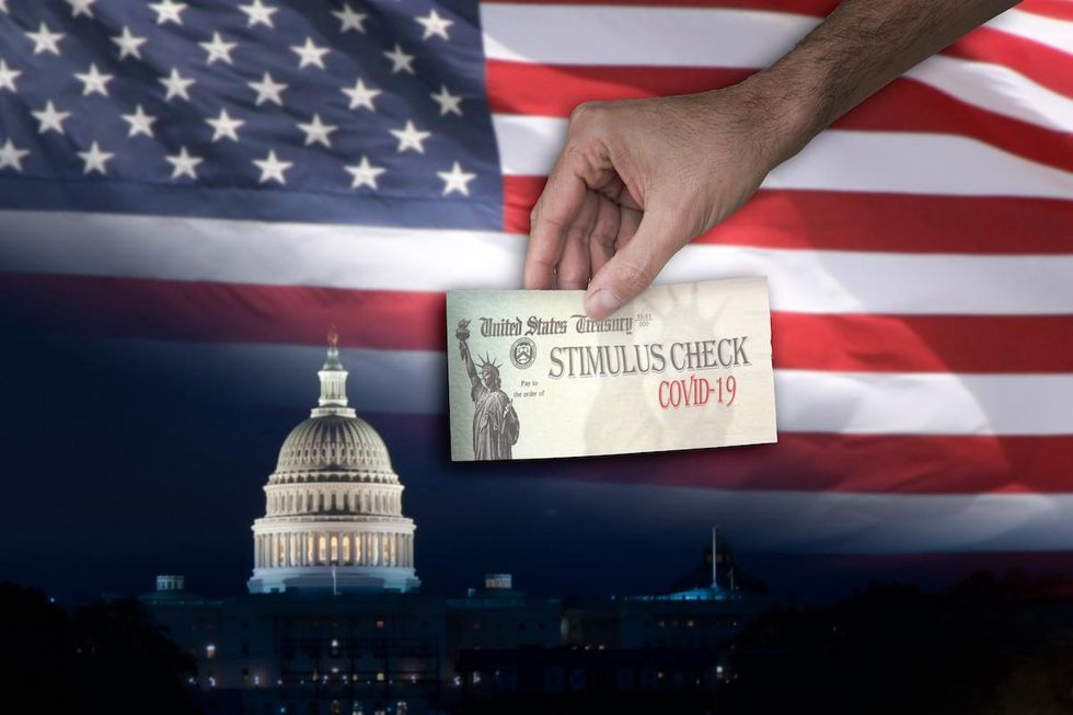 stimulus check with US flag in background