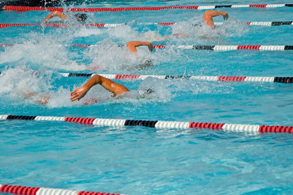 swimmers competing in swim meet