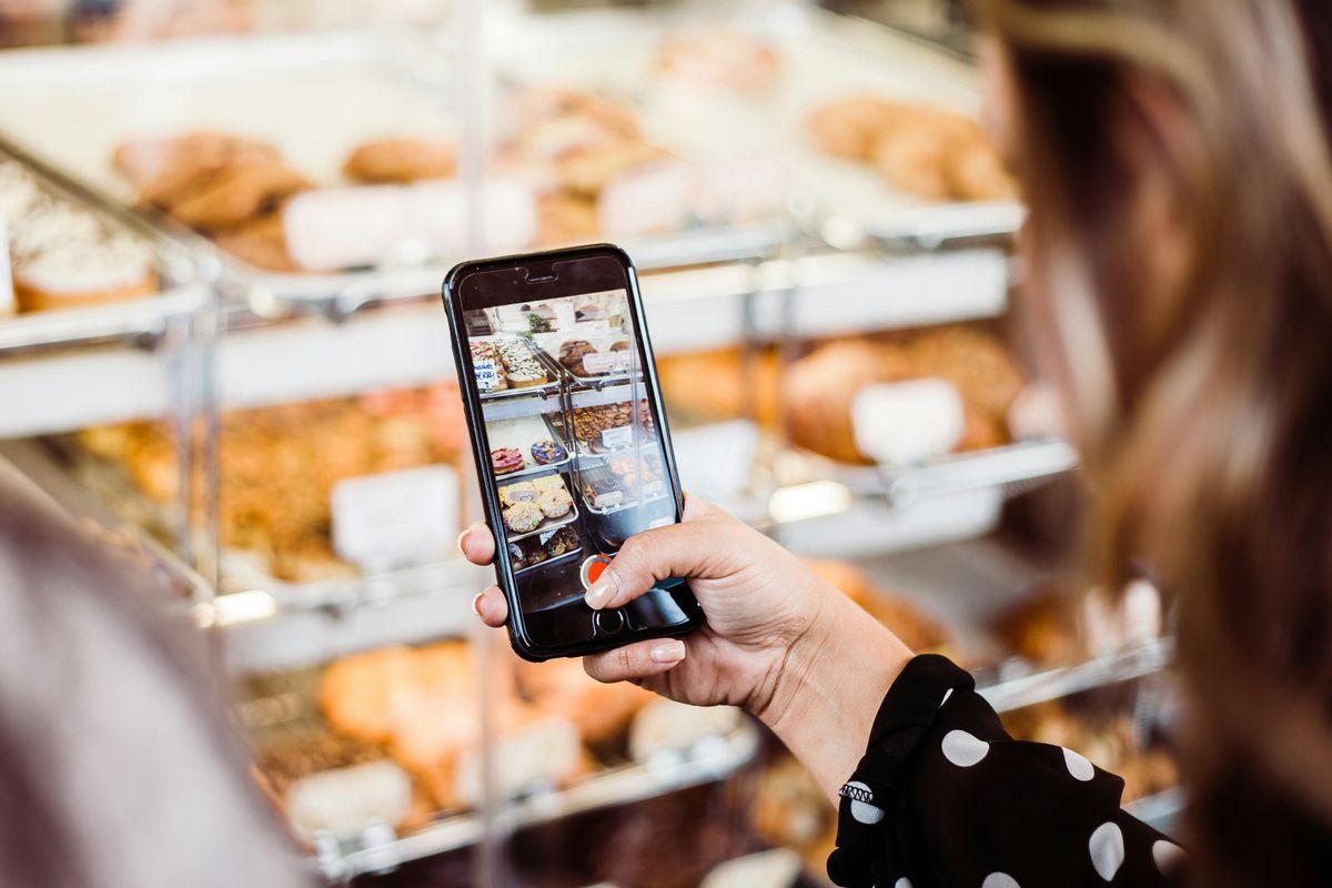 Taking a photo at a small business for Instagram account