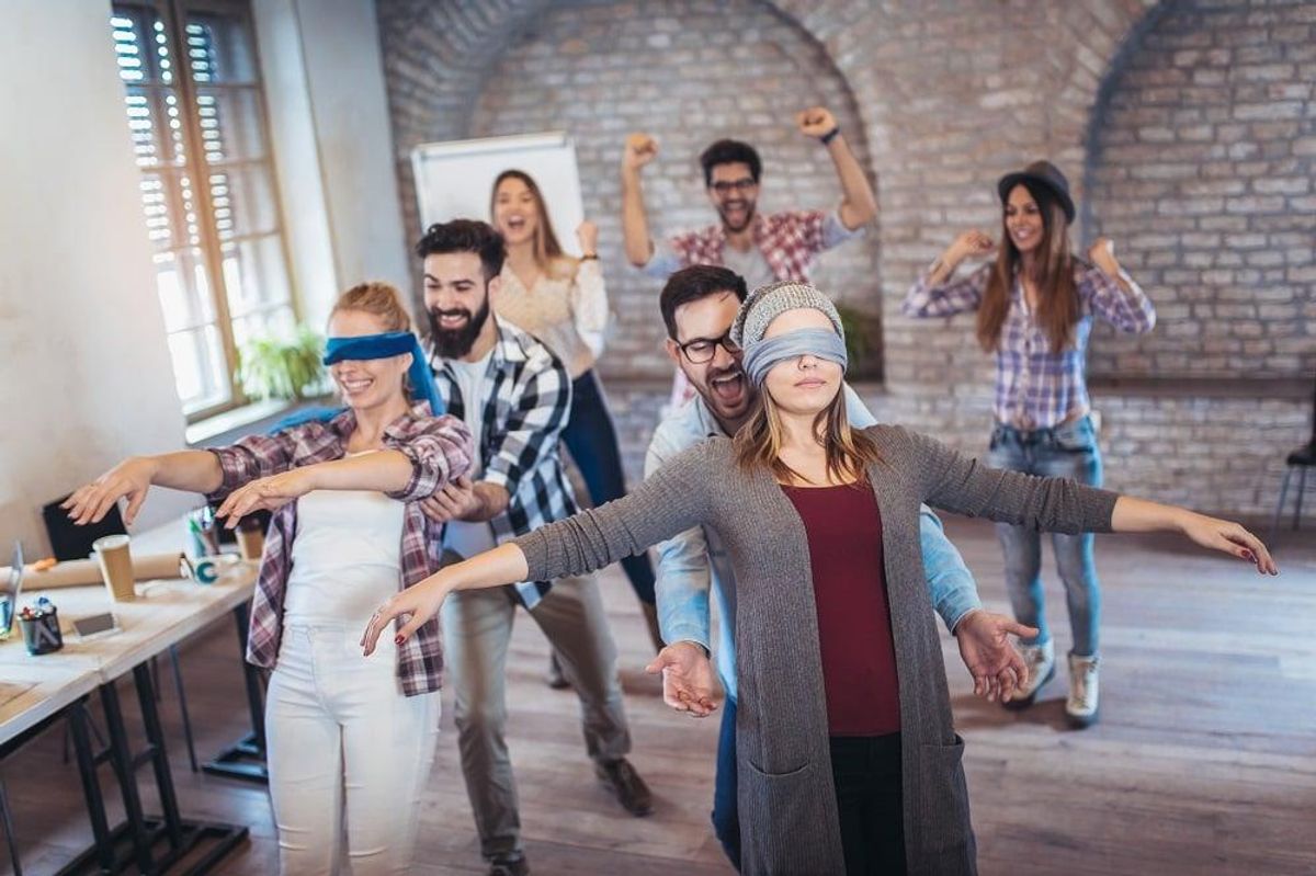 Team at an off-site doing trust exercises