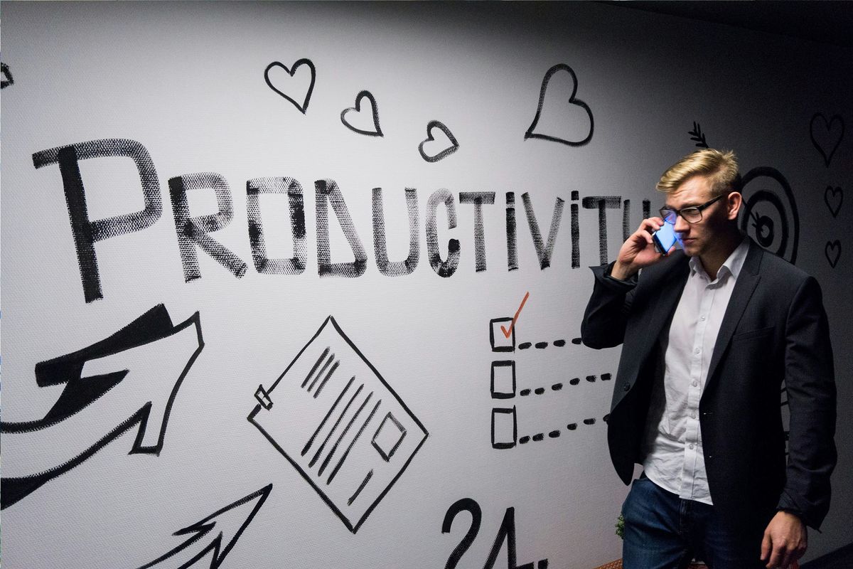 Team member on phone being productive