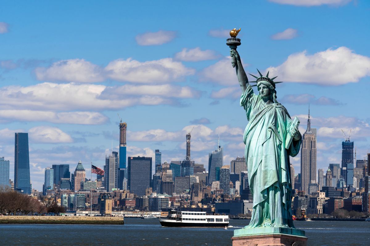 The Statue of Liberty over the Scene of New york cityscape