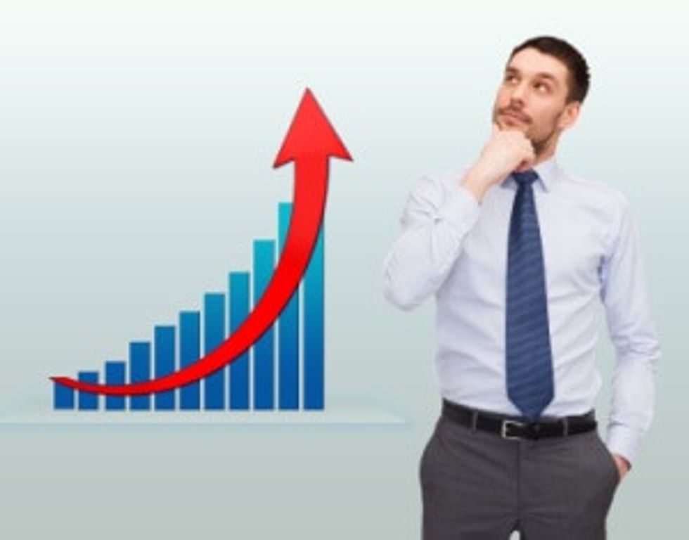 thinking young businessman with growth chart