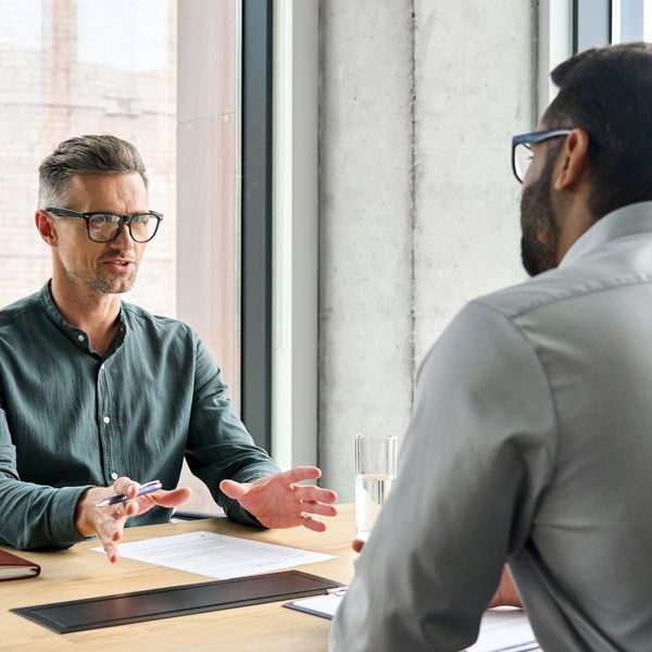 Two business leaders negotiating at a meeting