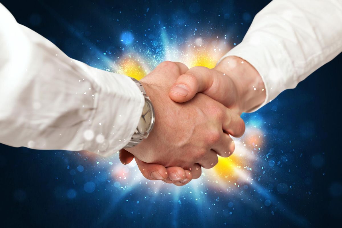 Two business men shaking hands