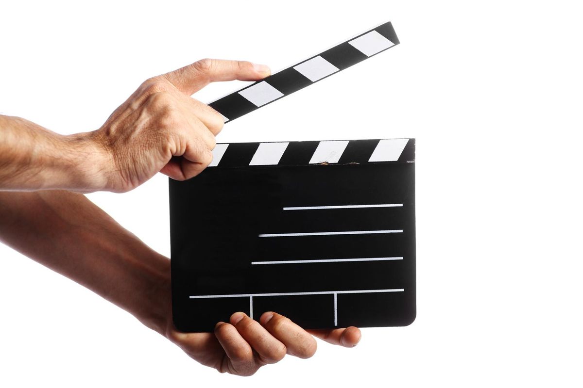 Two hands holding a cinema clap