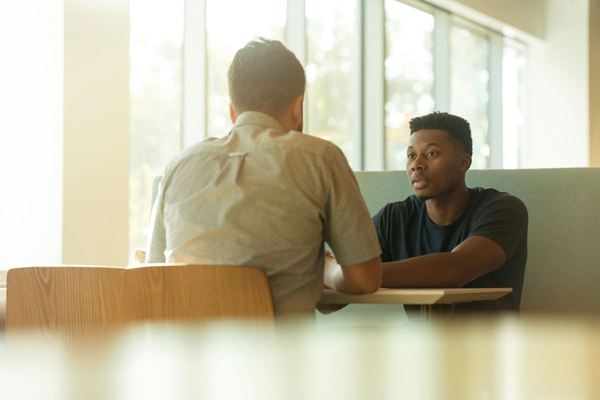 two men talking sales