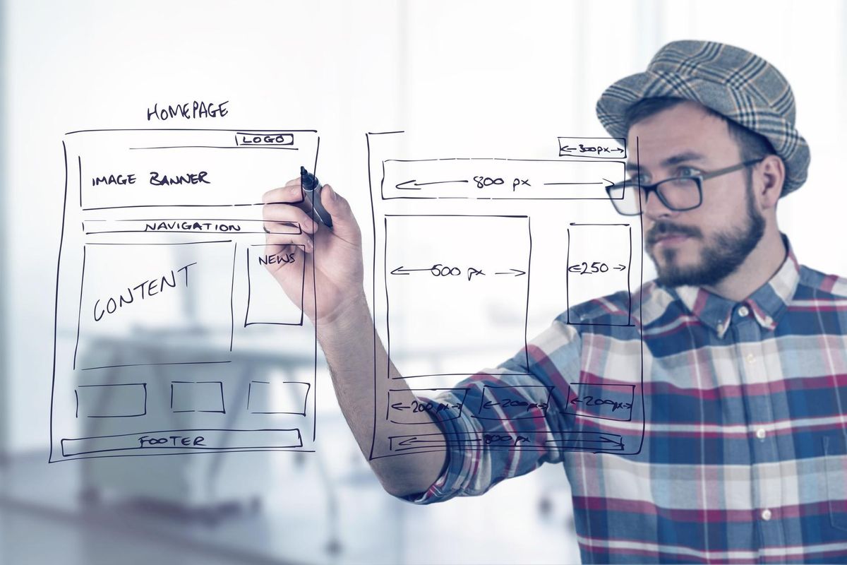 web developer drawing website development wireframe