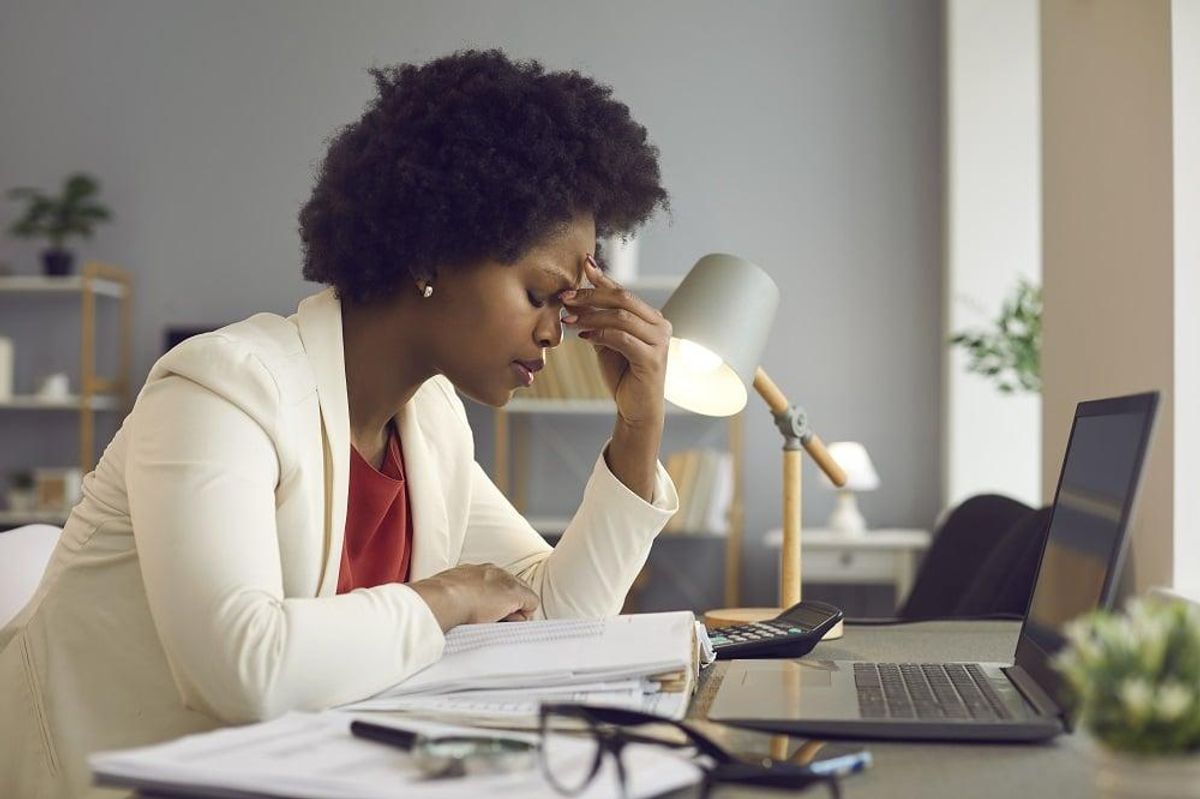 Woman entrepreneur feeling tired and stressed,