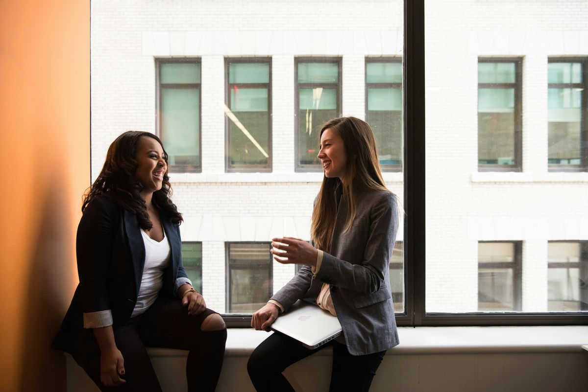 Woman entrepreneur helping another through mentoring