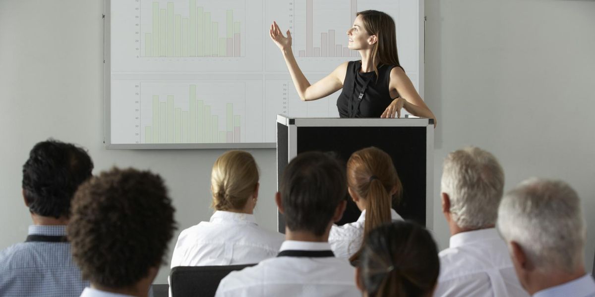 Woman giving corporate investor pitch