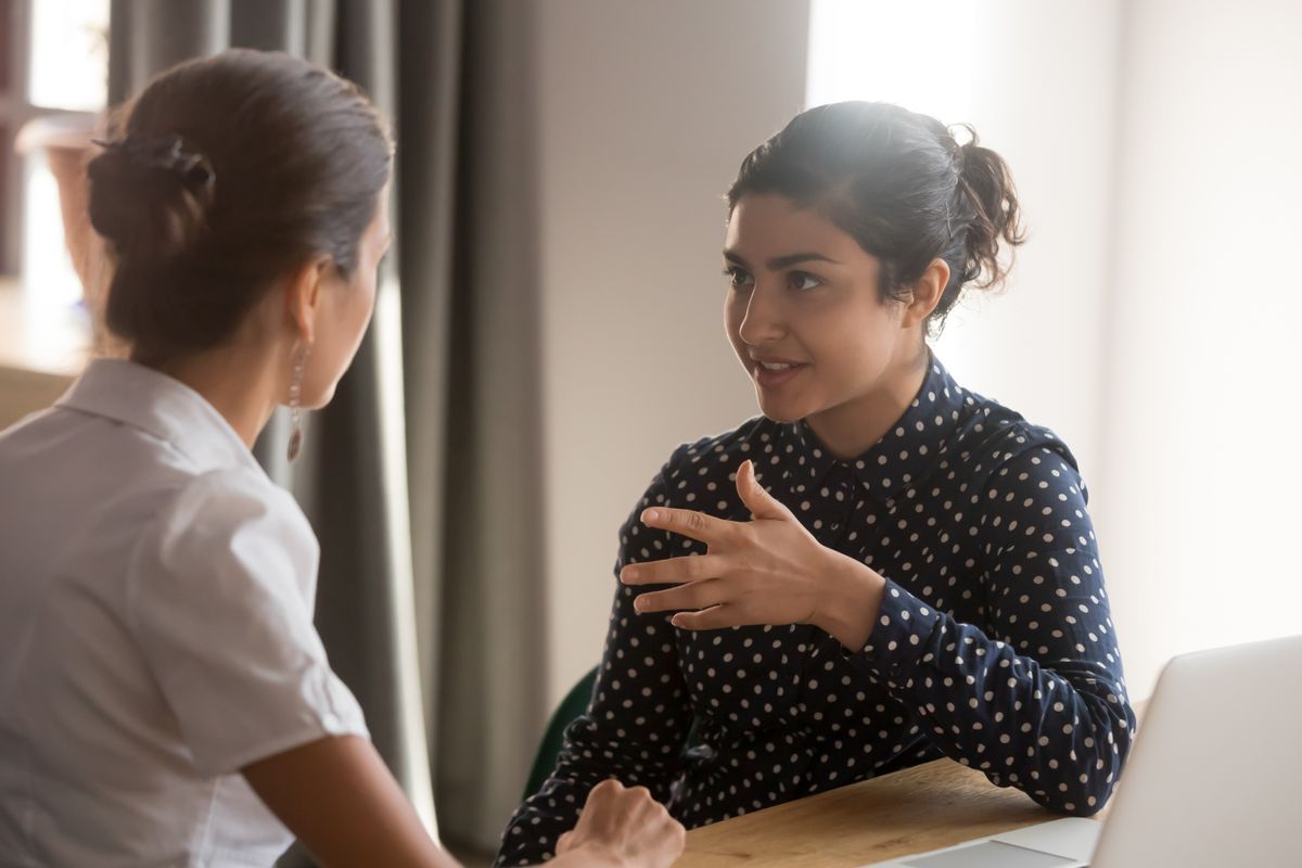 Woman giving feedback to her employee