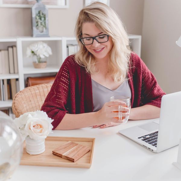 Woman in a pretty, bright home office space