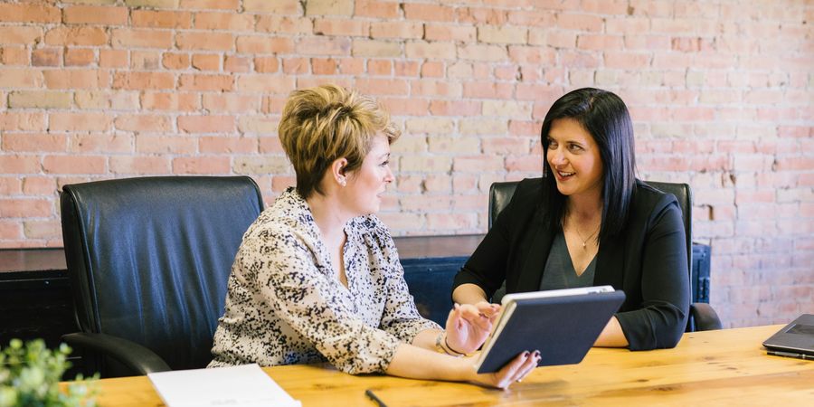 Woman in business being a leader by listening