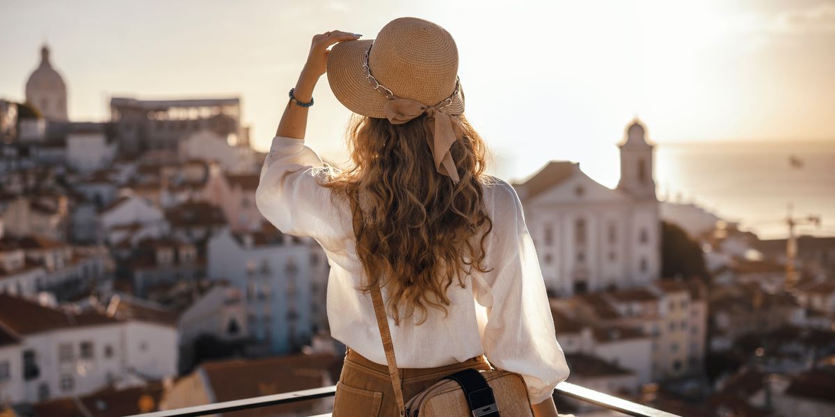 Woman standing on the balcony of an easy residency country