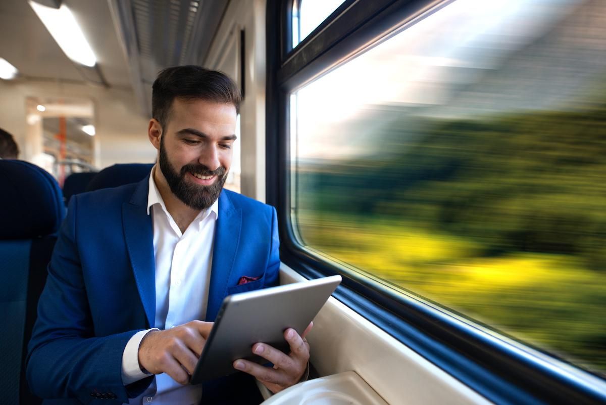 young businessman reading tablet