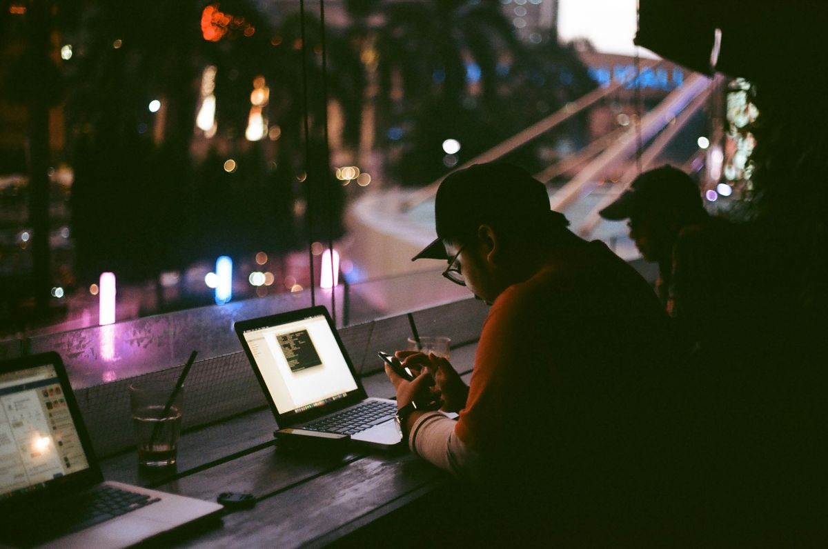Young entrepreneur works on his side hustle after business hours