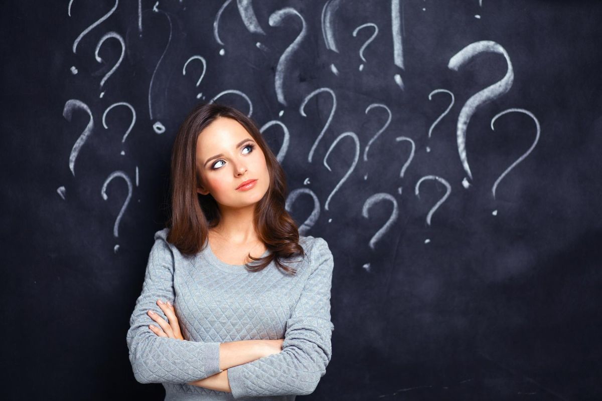 Young girl with question mark