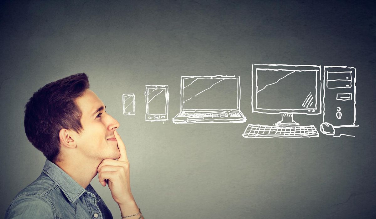Young man choosing a communication gadget